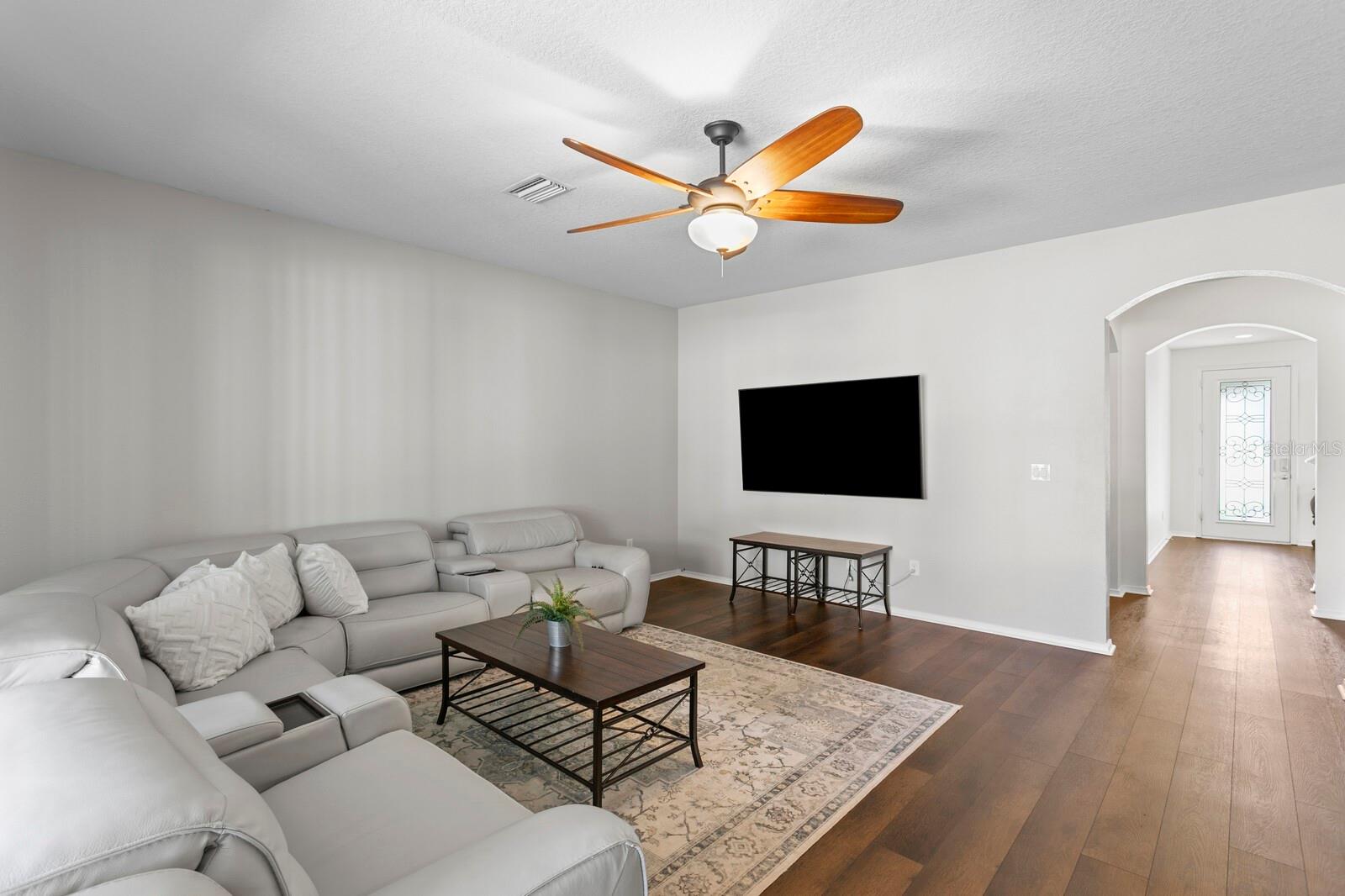 Large family room with ceiling fan