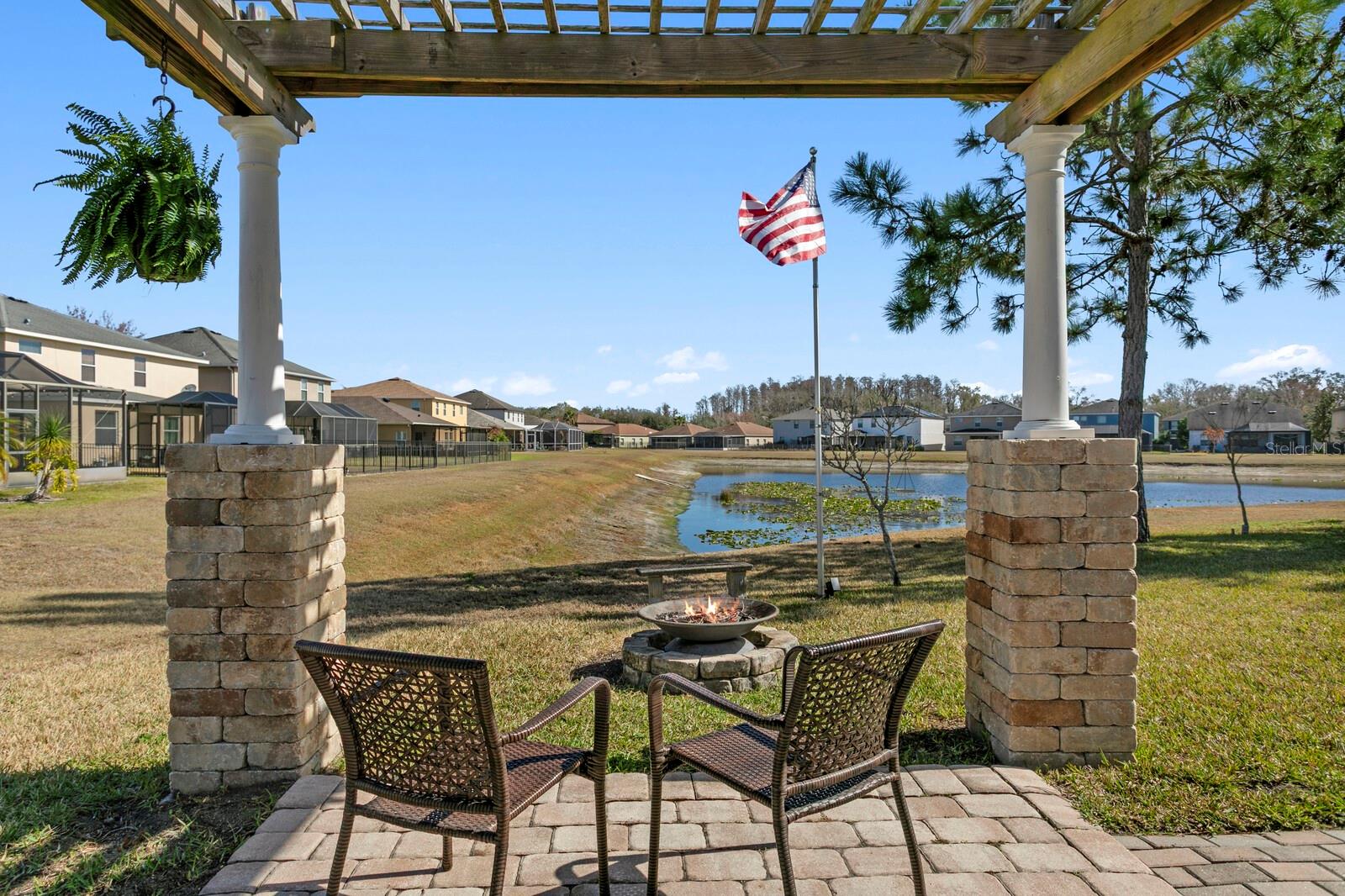 Relax under the backyard pergola with water views