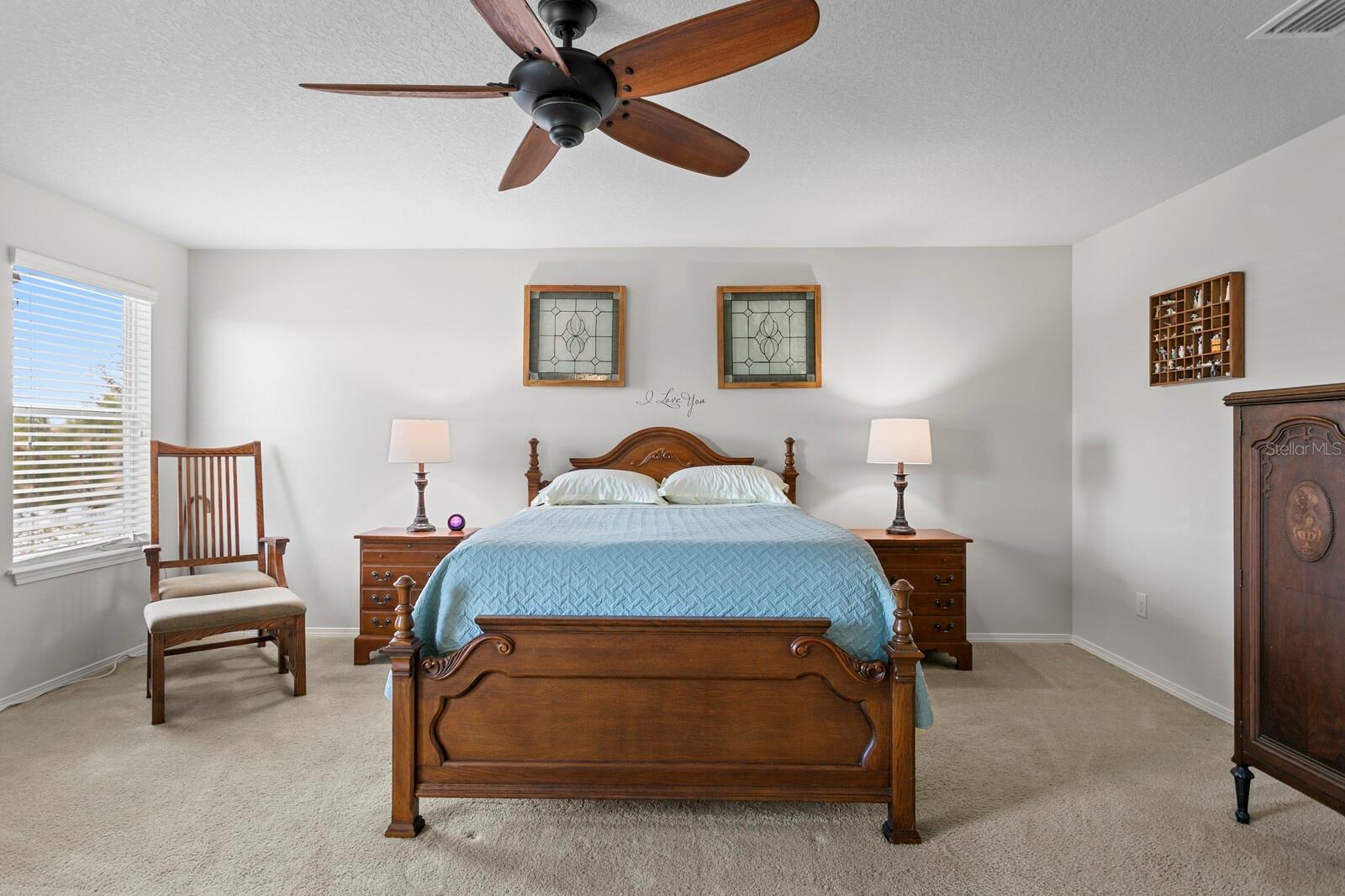 Large primary suite with ceiling fan