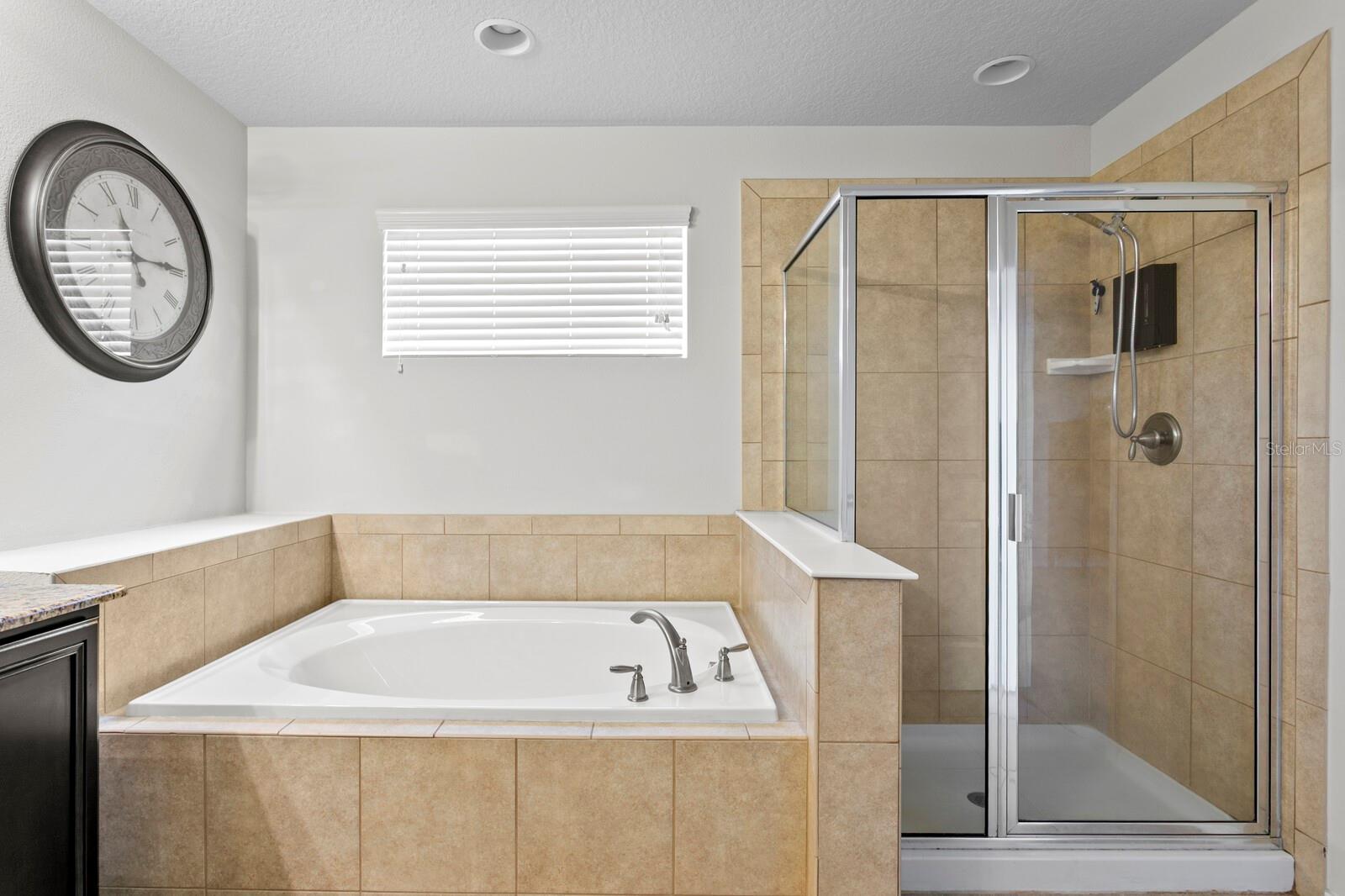 Primary bath with garden tub and walk-in shower