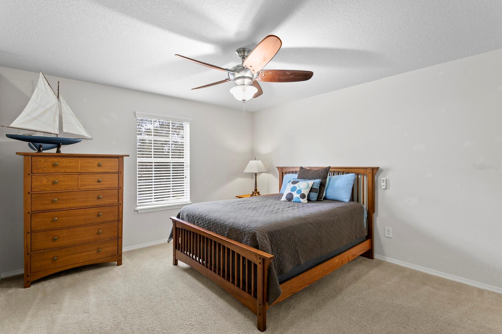 2nd bedroom with ceiling fan and ensuite bathroom