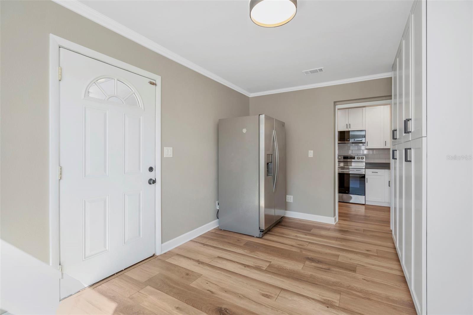 Dining Room/Office space with second refrigerator and cabinetry
