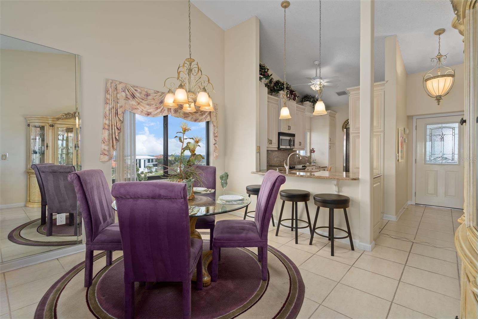 Dining room with high ceilings and skylight