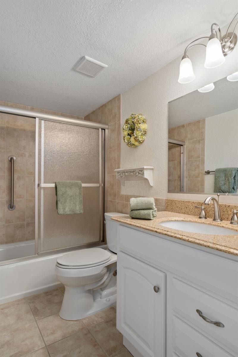 Guest bath with updated vanity and tops