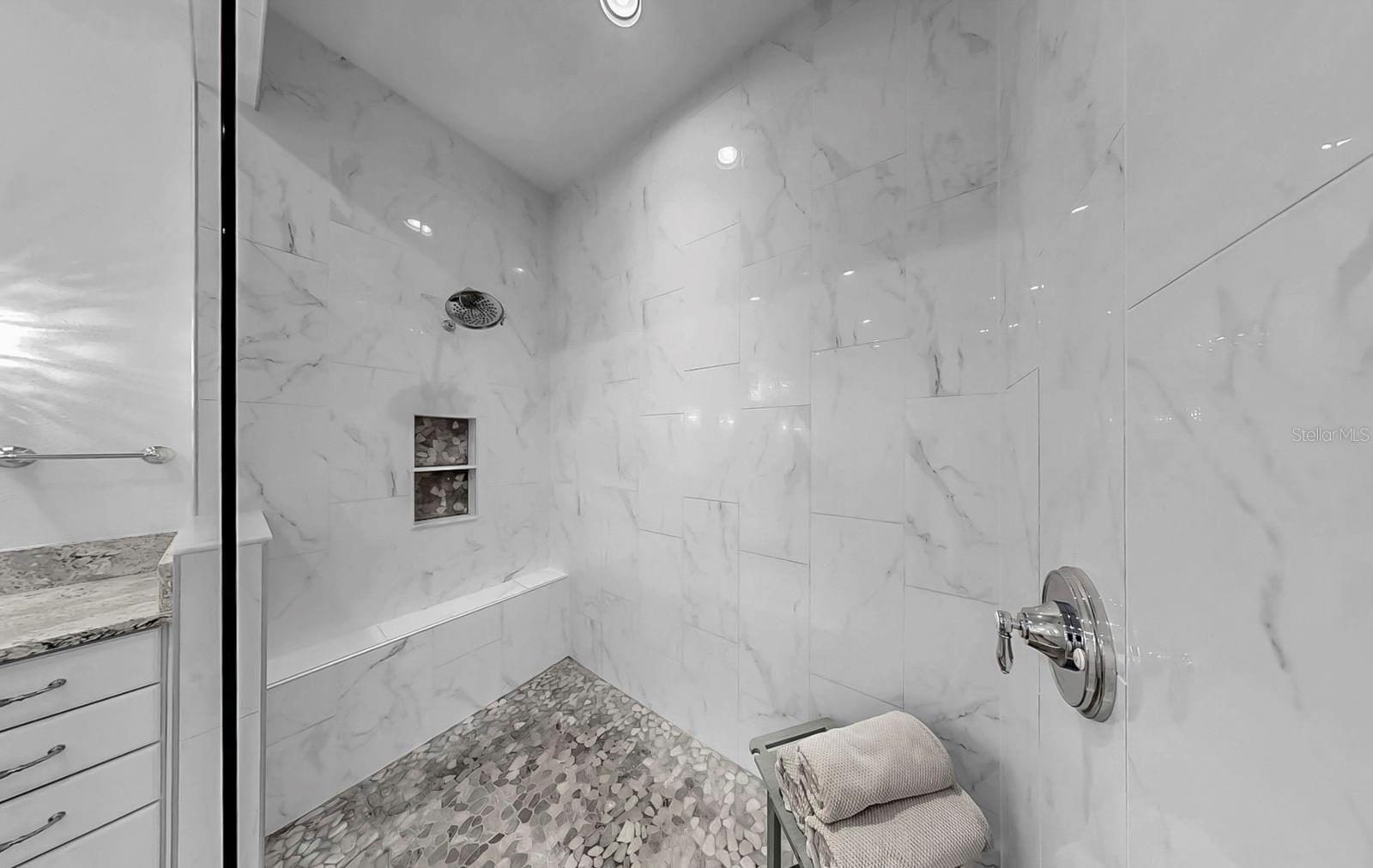 Walk-In Shower with Dual Niches, Bench and Floor to Ceiling Tile