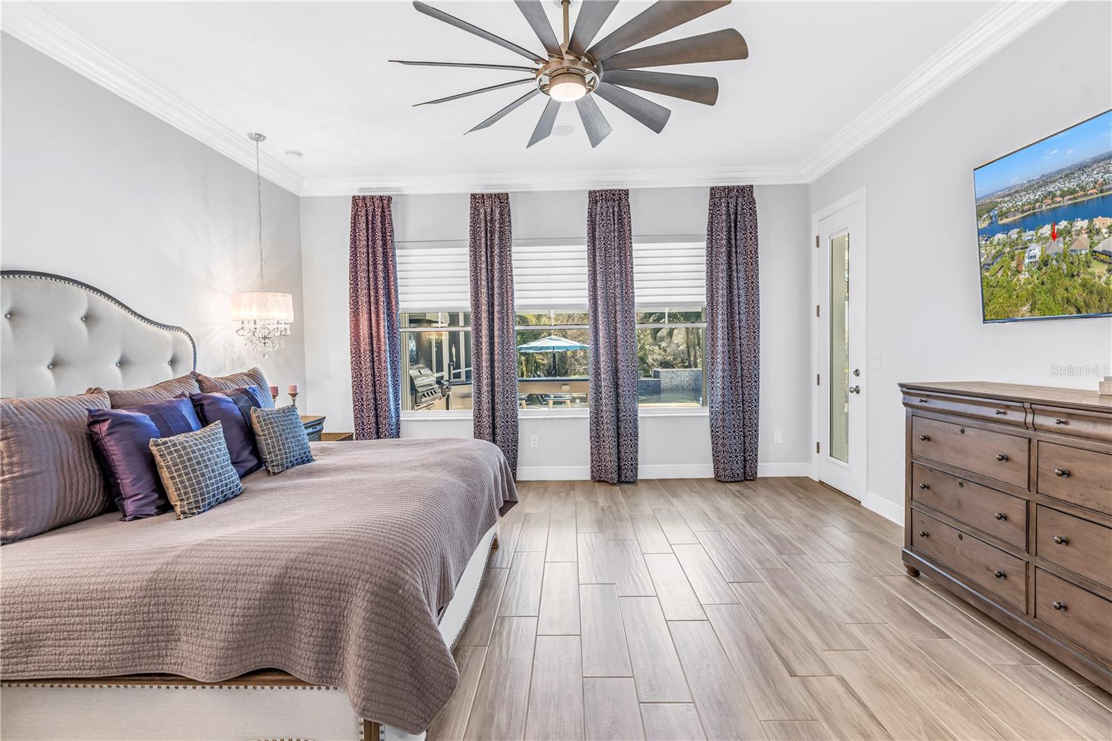 Master Bedroom with Views of the Expansive Pool Deck and Preserve