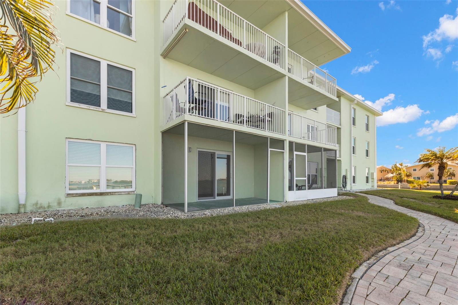 Desirable first-floor location with screened lanai and direct access to beautifully maintained waterfront grounds along the Intracoastal.