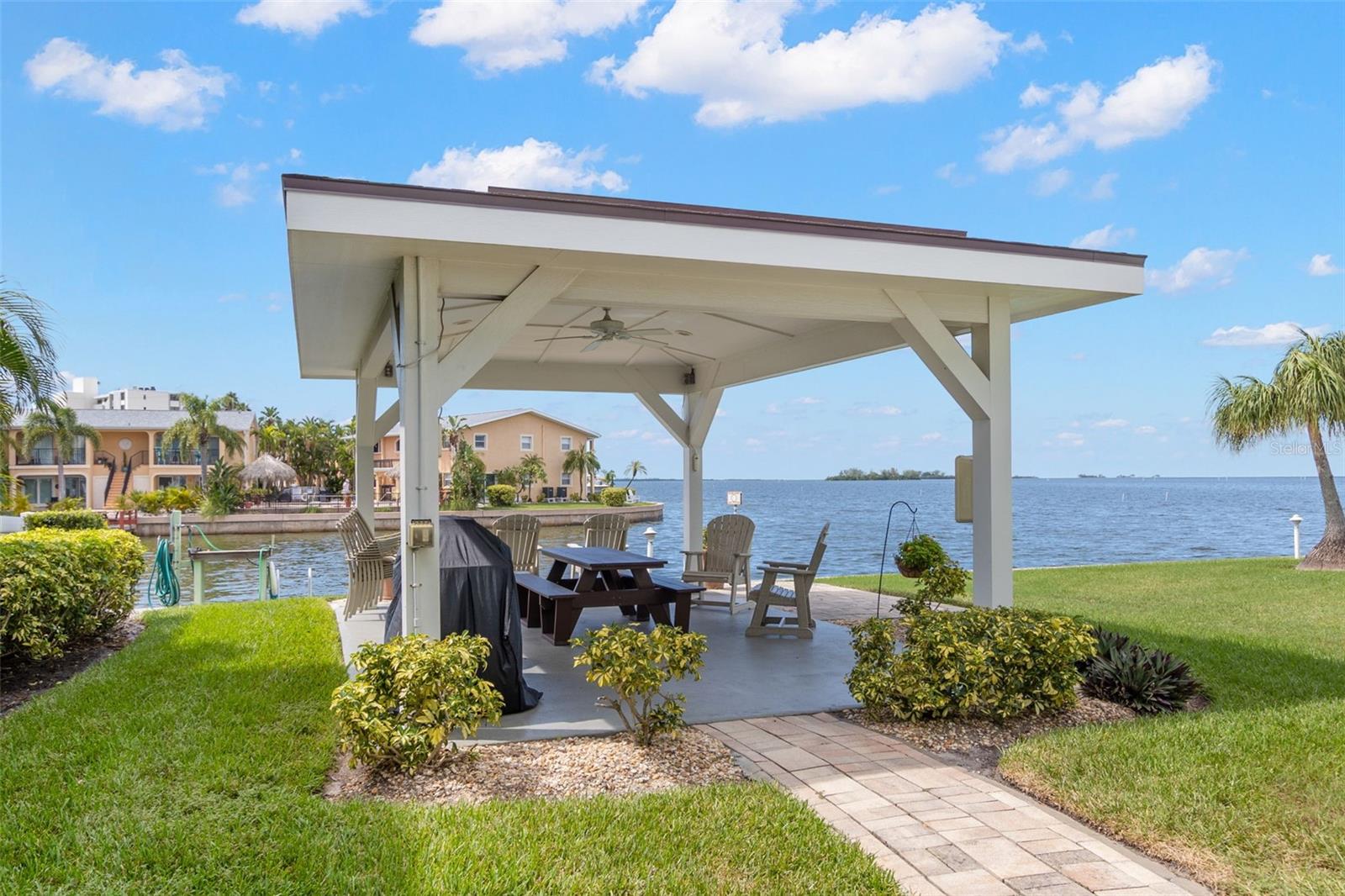 Enjoy the community’s covered bayfront pavilion — perfect for outdoor dining, grilling, and relaxing with panoramic water views.