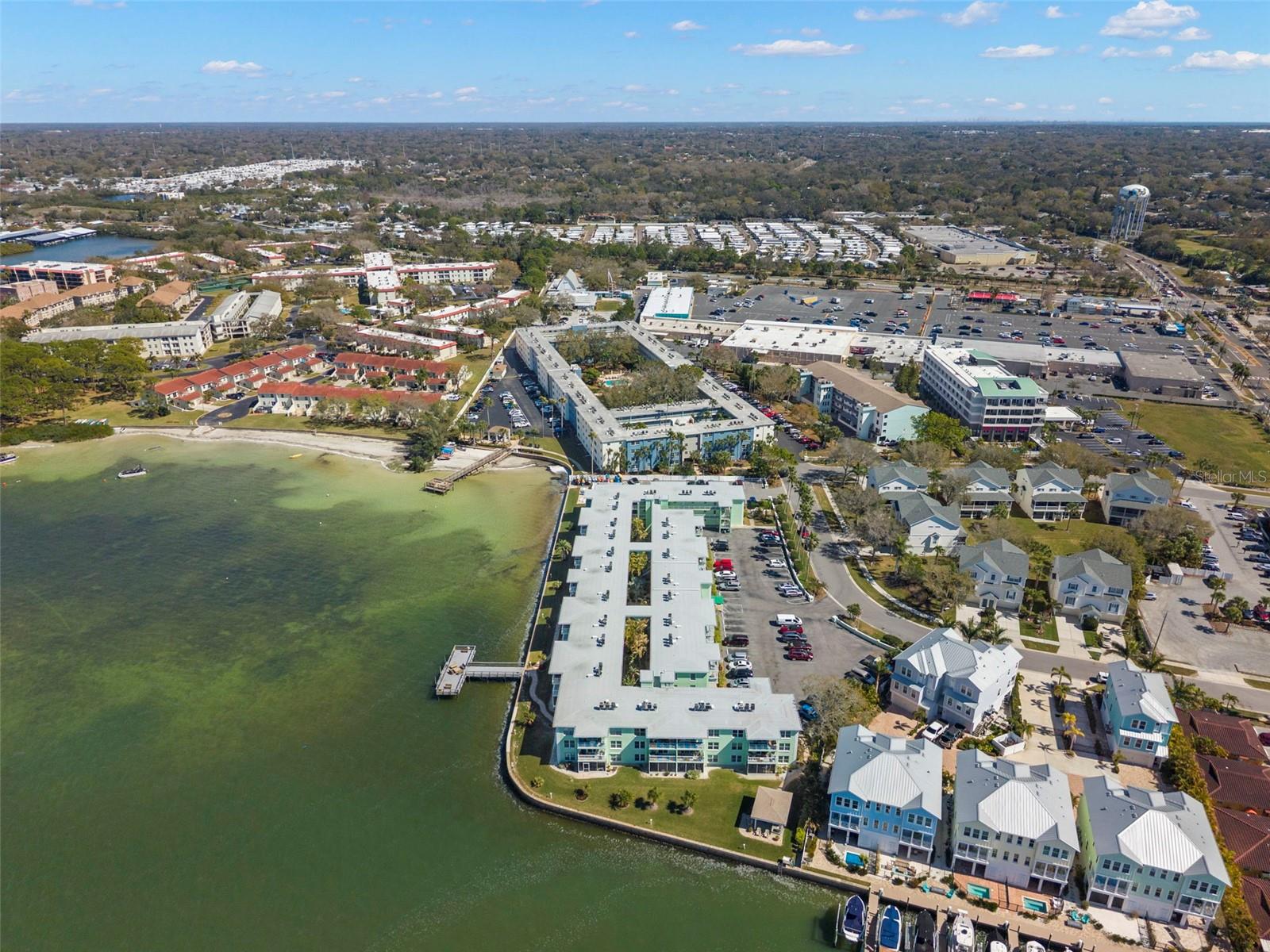 Prime waterfront location with community dock, nestled along the bay and just moments from shopping, dining, and daily conveniences.