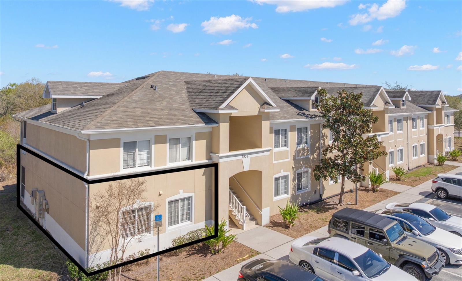 Well-maintained block and stucco condominium building in the gated Villages of Bloomingdale community. This first-floor residence offers easy access with assigned parking just steps away. Architectural detailing includes a covered entry, clean rooflines, and landscaped sidewalks, creating a welcoming approach.