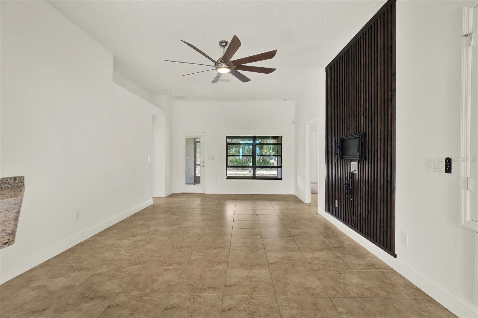Living Room with custom wall paneling and TV wall mount