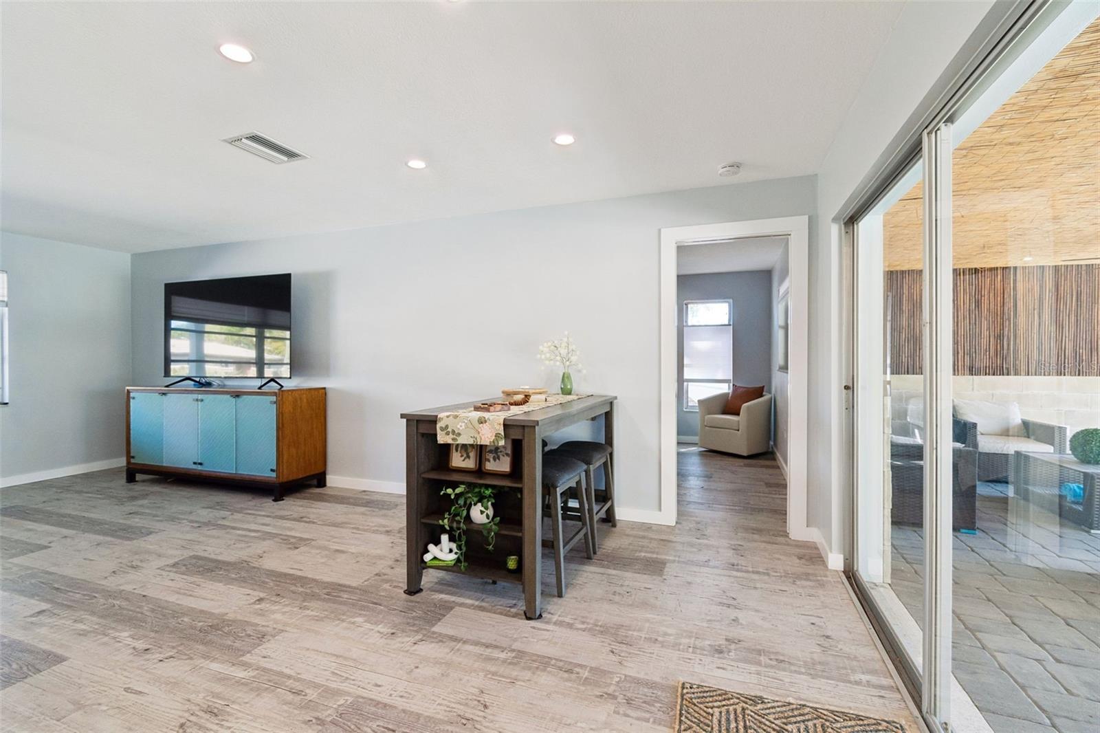 Sliders from Living Room/Kitchen out to back patio and pool