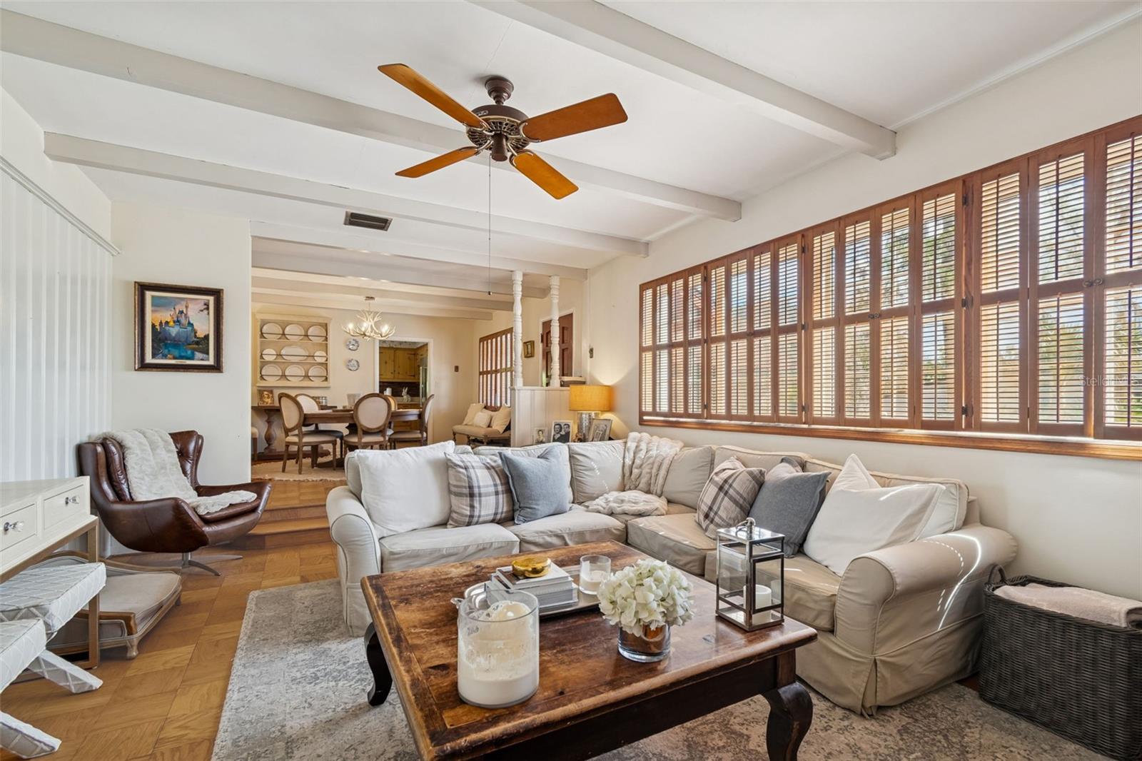 Formal Living Room w/Wood Beams, Wood Shutters, & Brick Fireplace
