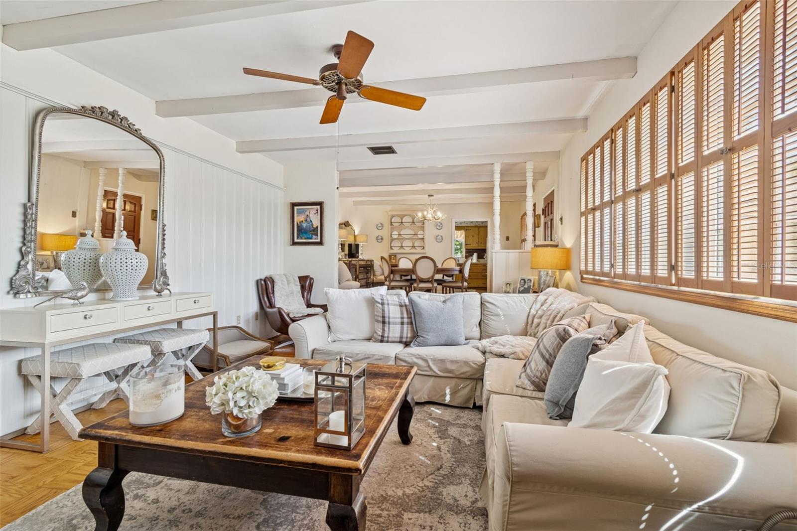 Formal Living Room w/Wood Beams, Wood Shutters, & Brick Fireplace