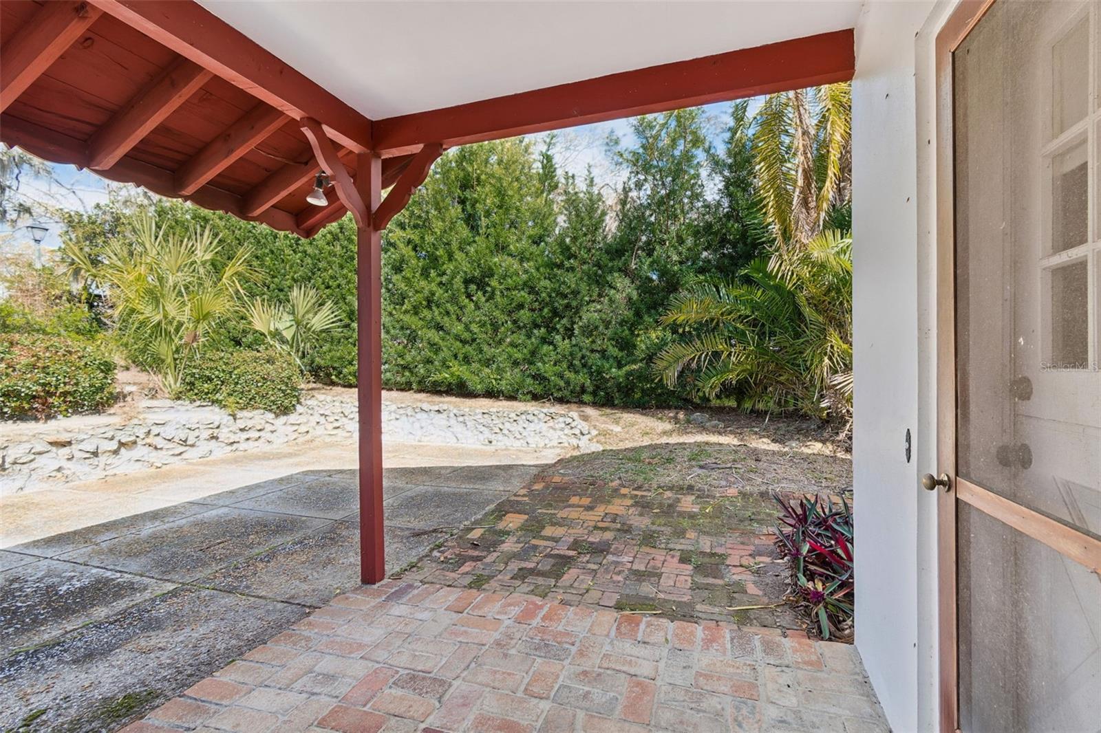 Pavered, Covered Patio adjacent to Brick & Concrete patio