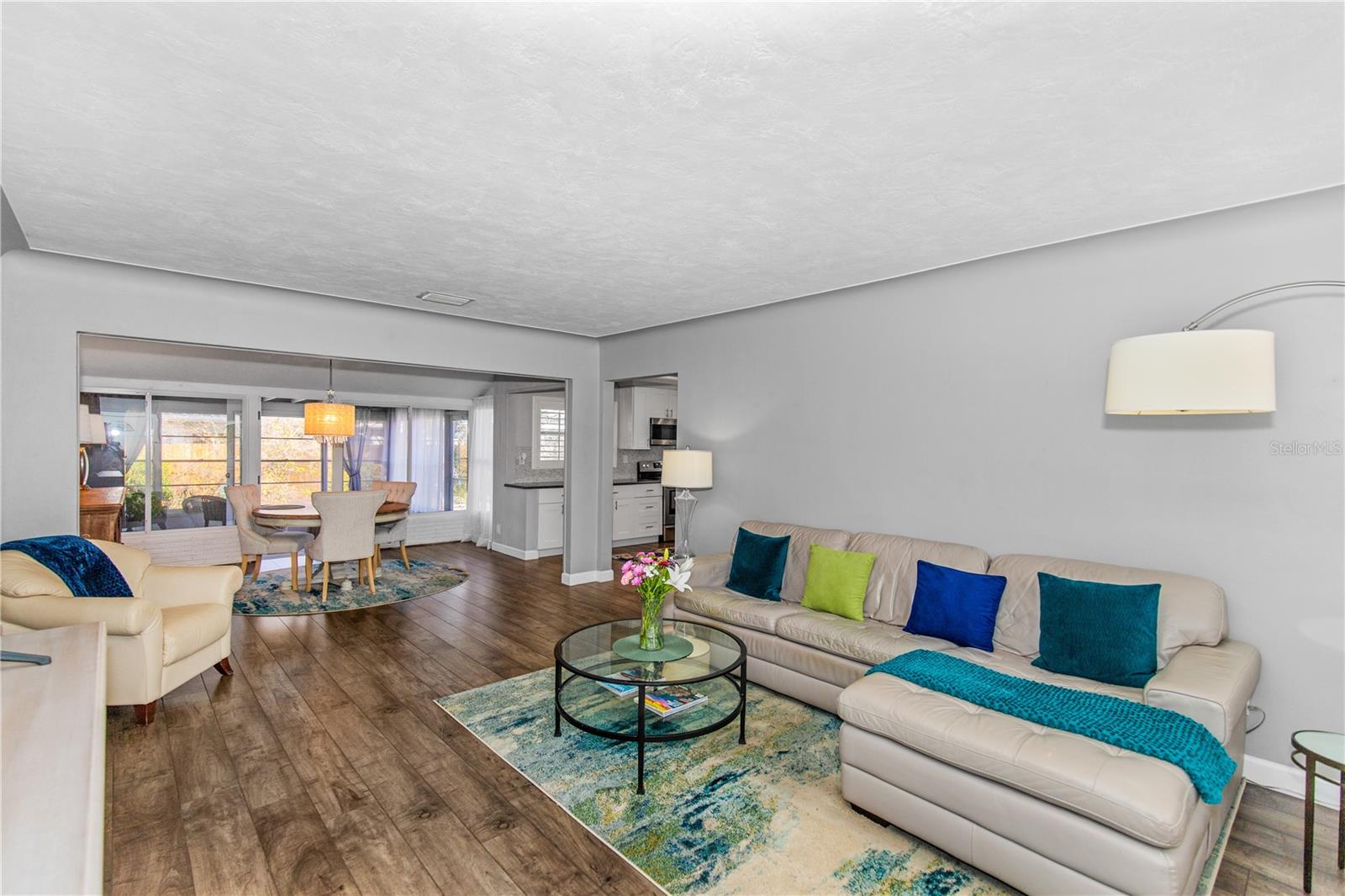 Enter front door to a large living room space