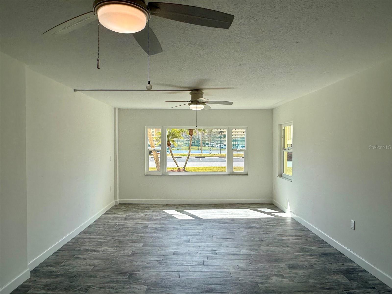 Impact windows with tennis court views.