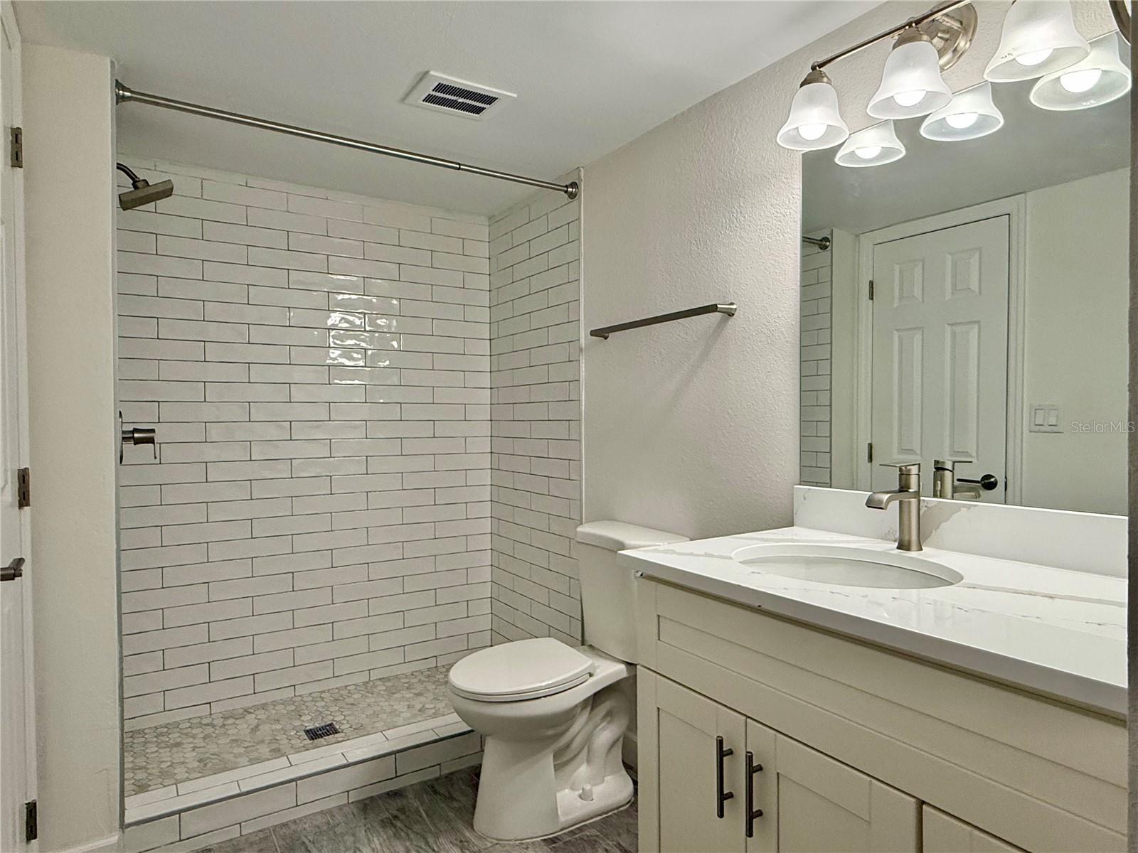 Large 14x11 bedroom with tile flooring.