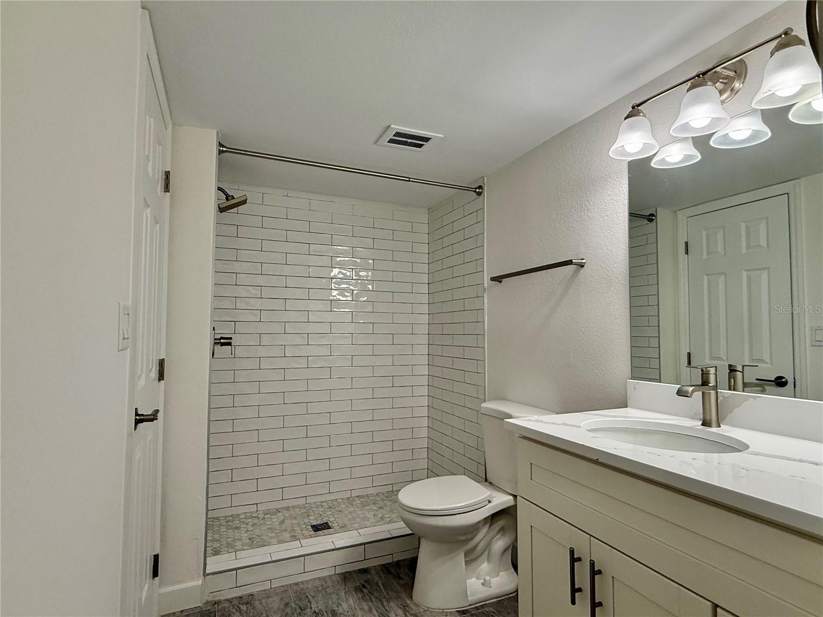 Large 14x11 bedroom with tile flooring.