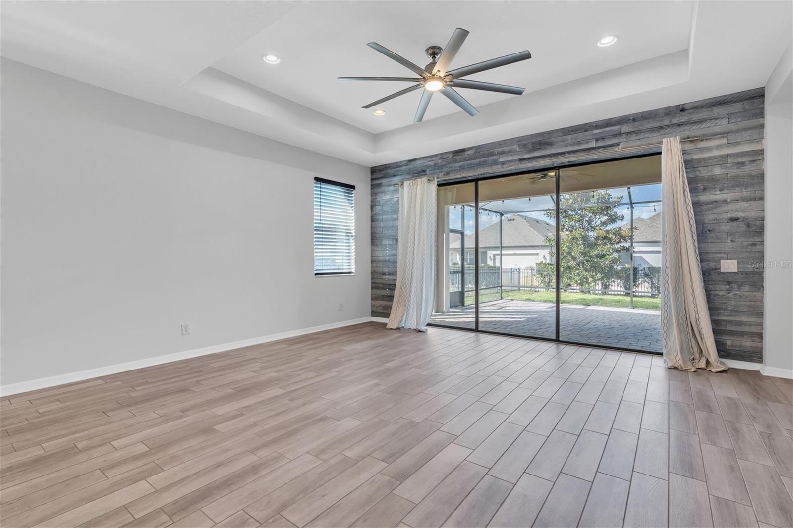 LIVING ROOM WITH WOOD ACCENT WALL