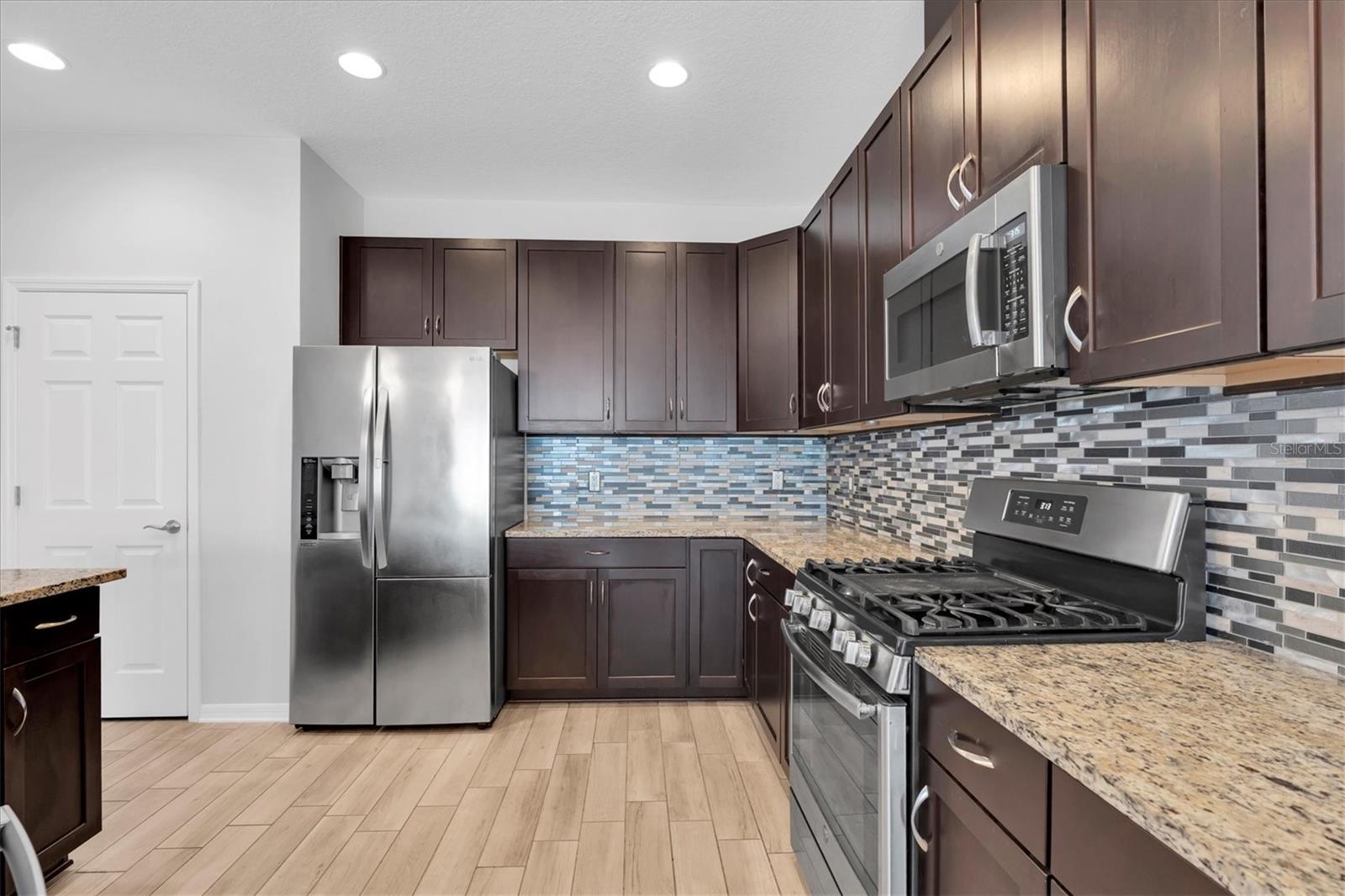 PLENTY OF WOOD CABINETS, DRAWERS  & GRANITE COUNTER SPACE