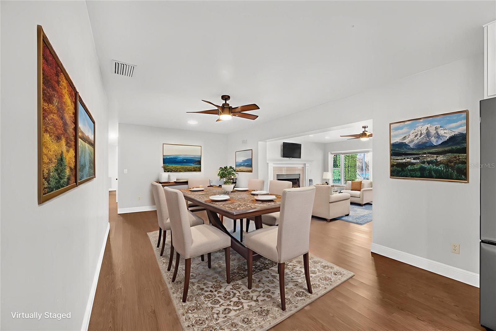 The dining room opens to a large Living room with the stunning unobstructed lake views.