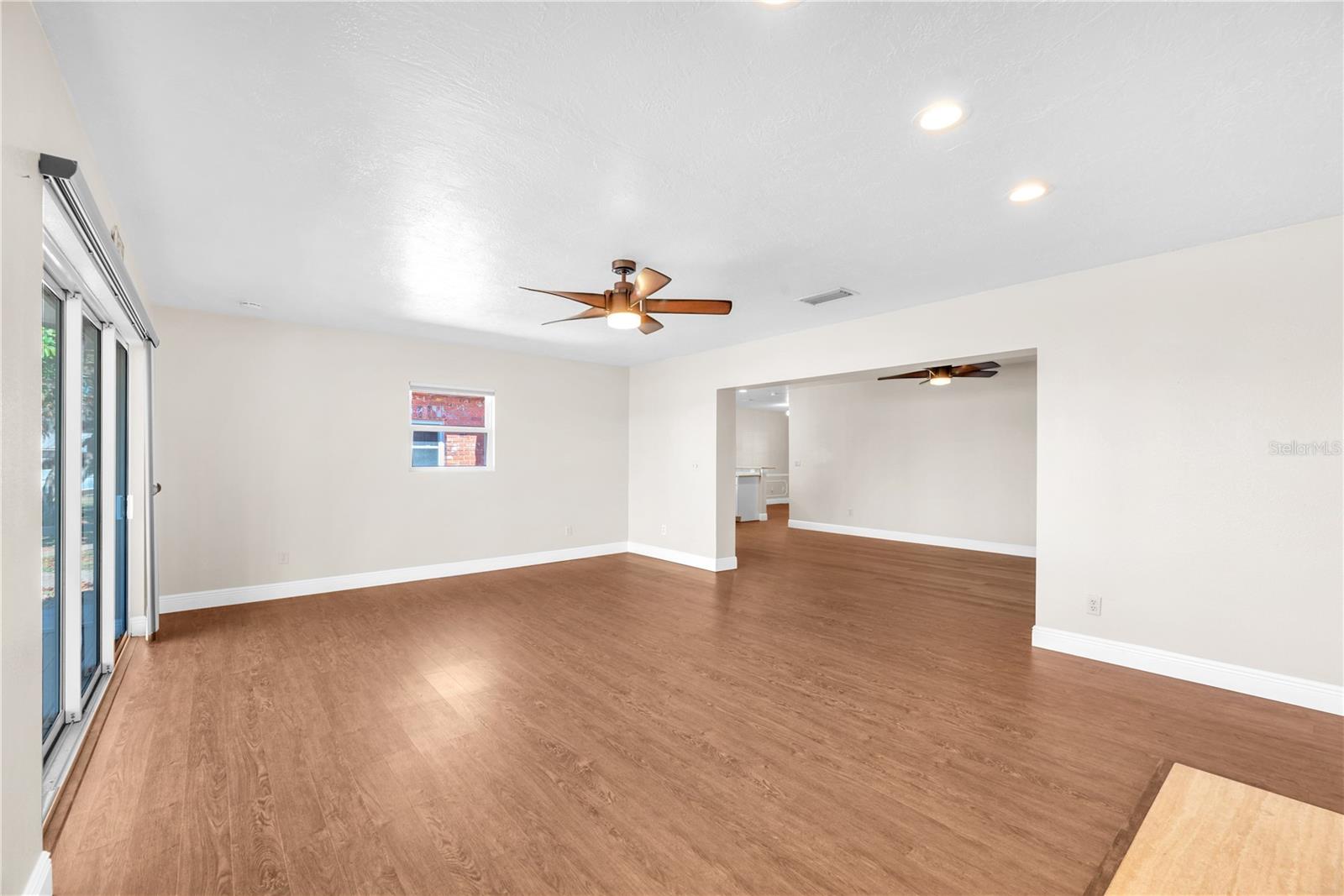 The living room has waterproof laminate flooring with cork backing for comfort and is 20' x 15'.