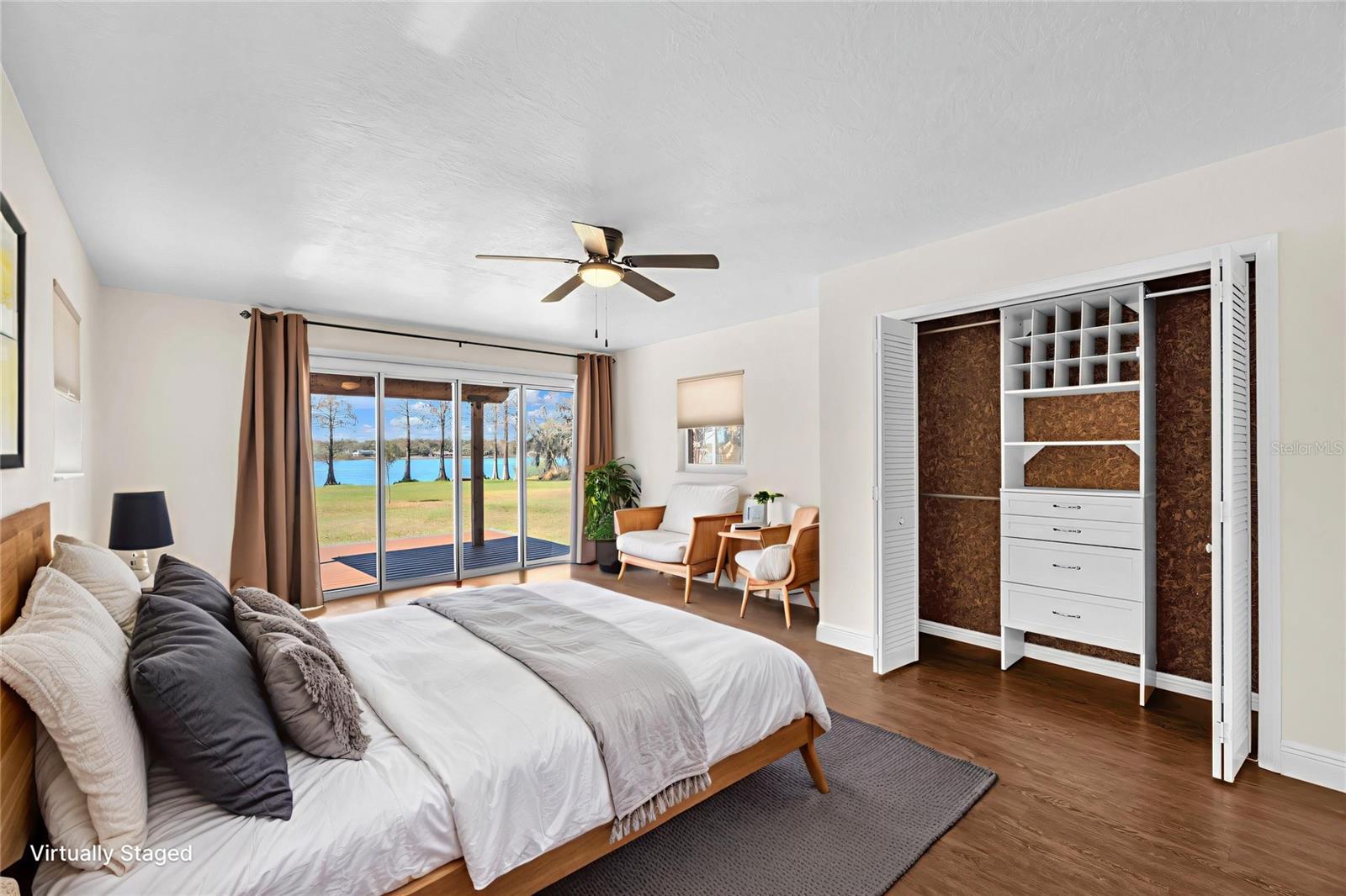 Wake each morning to stunning lake views and start your day feeling refreshed.  Accordion glass doors open to a covered deck to enjoy morning coffee or an evening cocktail while watching the sunset.