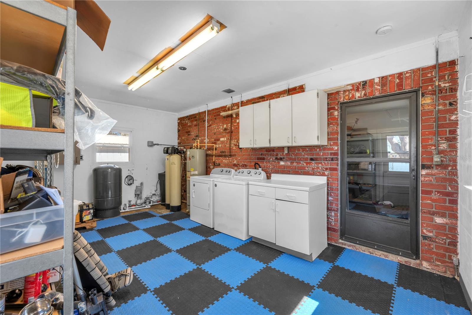 An expansive laundry room is conveniently located adjacent to the oversized garage and features a recently updated well pump, water softener system, water heater and Washer & Dryer.  There is a utility sink inside the garage.