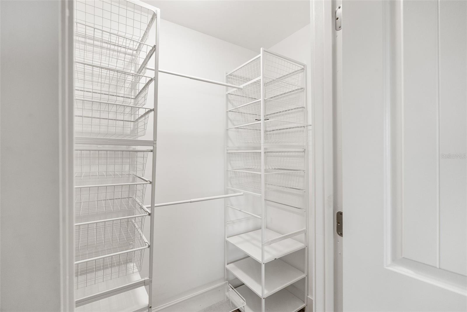 Walk-in closet in primary bedroom
