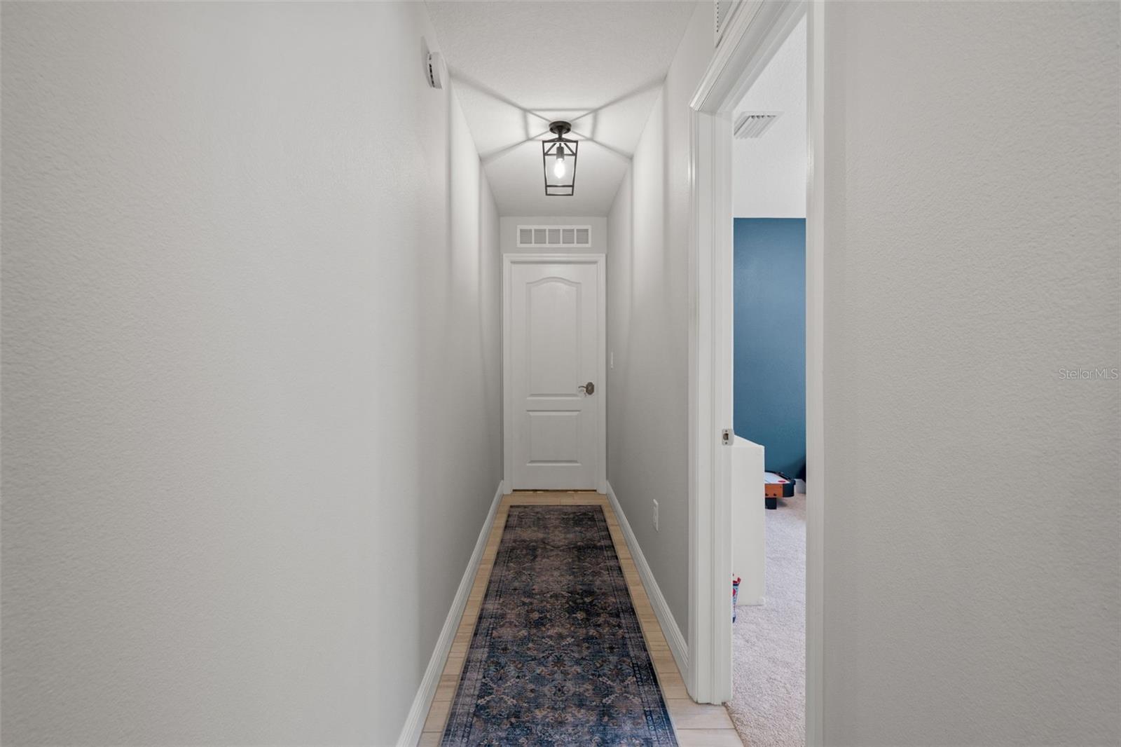 Hallway leading to additional bedrooms