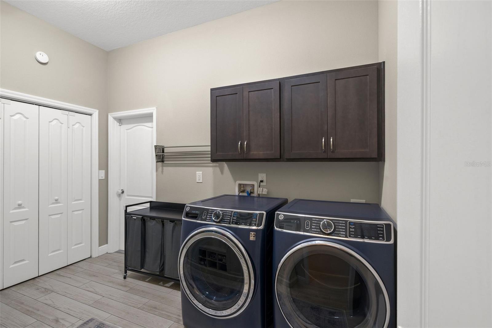 Oversized laundry room with storage