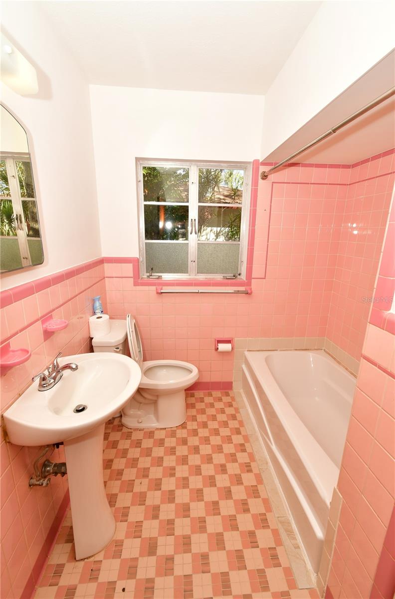 Large Bathroom with large linen closet, shower and bathtub