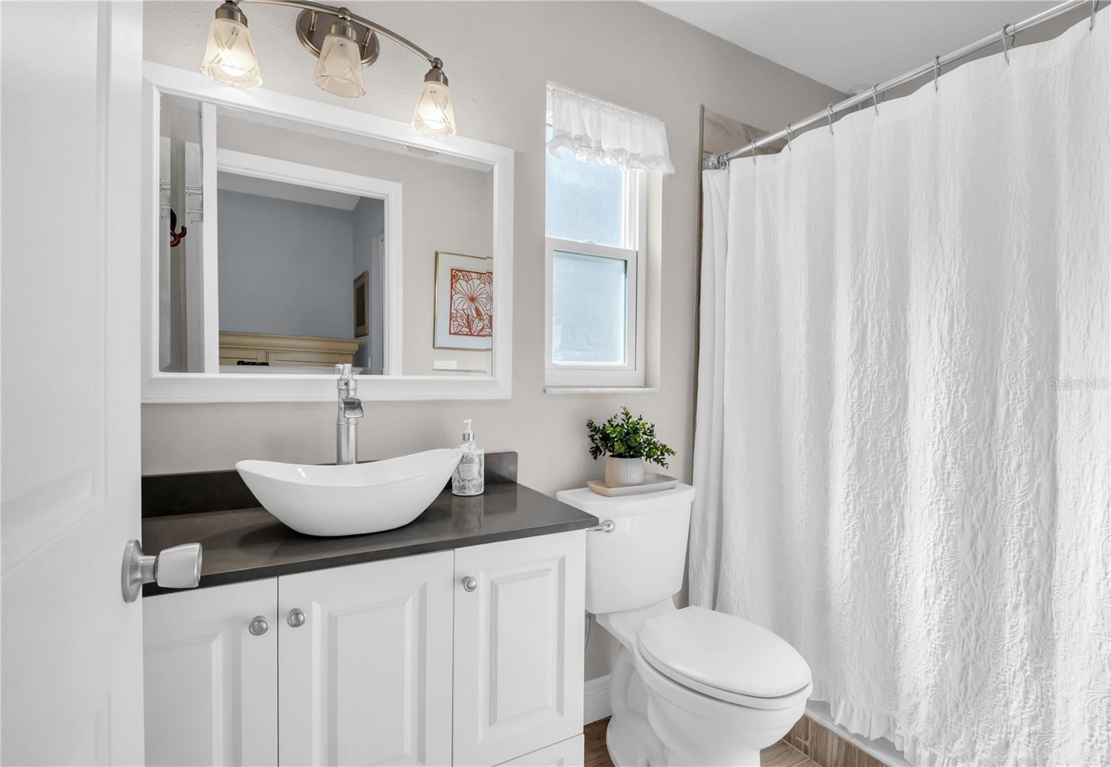 Modern fixtures, lighting and walk in shower ~