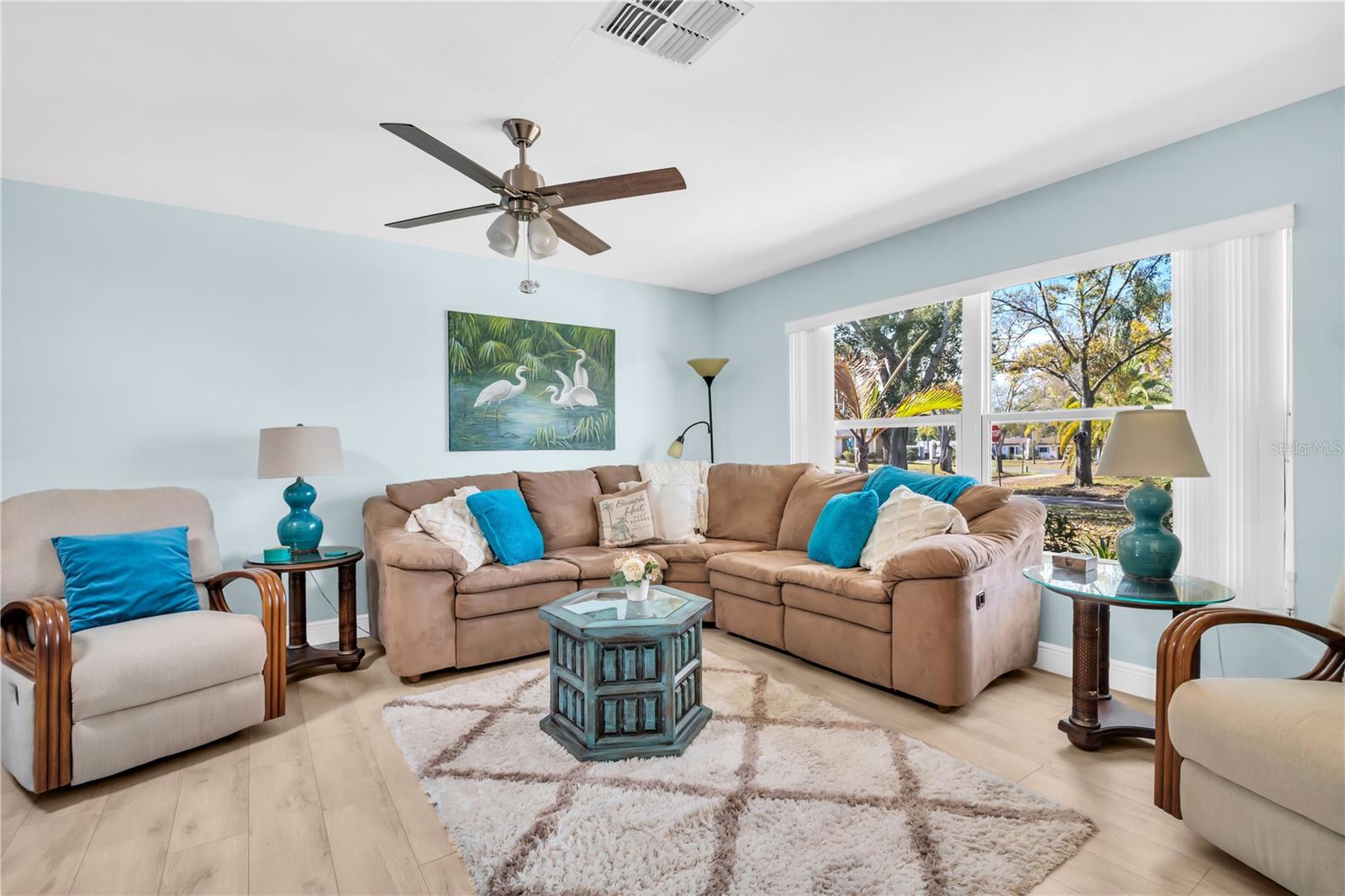 Consistent flooring throughout makes the flow between rooms seamless ~