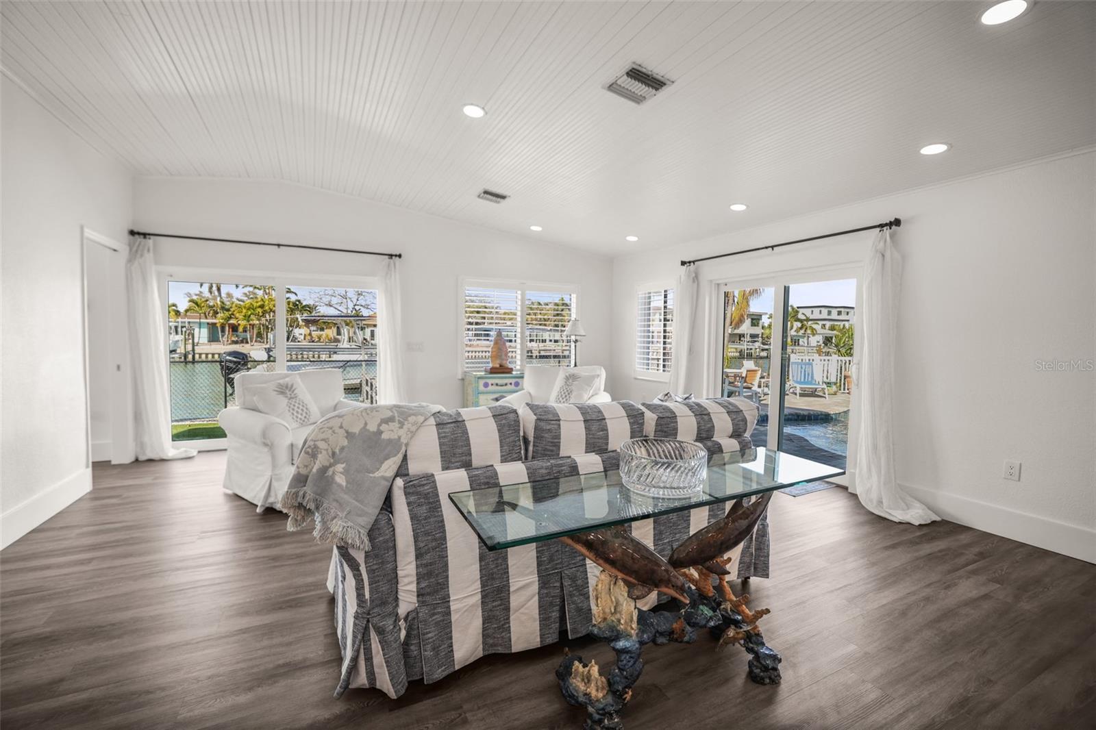 Light & Bright Family Room with 2 sets of Sliding Doors