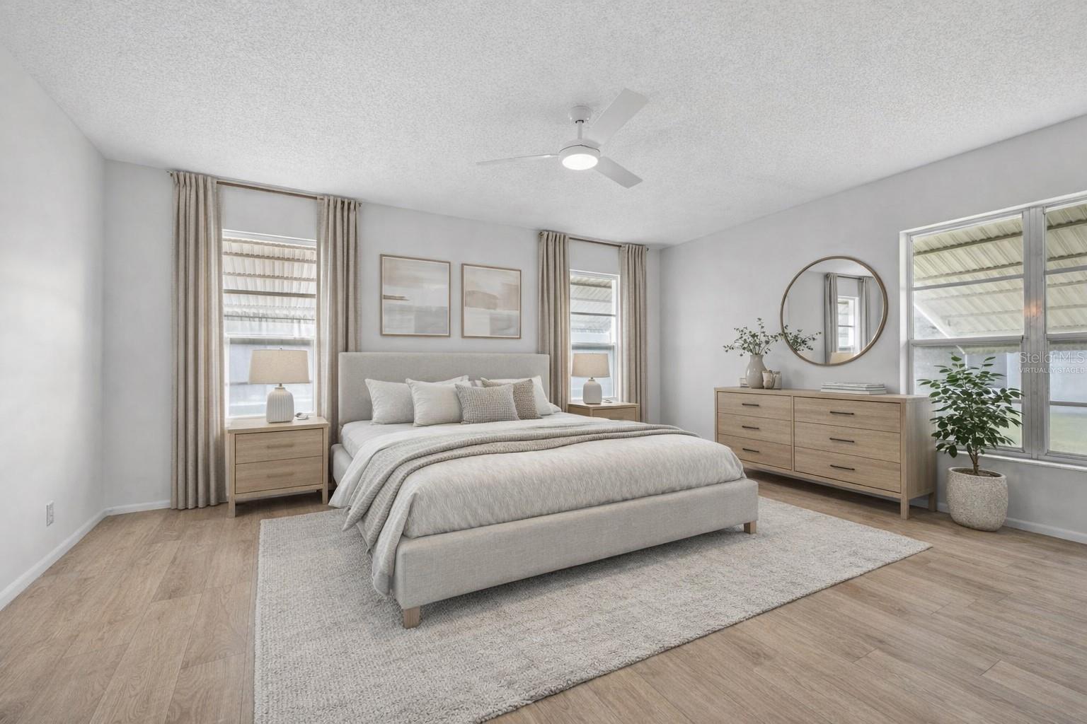 Virtually staged laminate floors - Primary bedroom