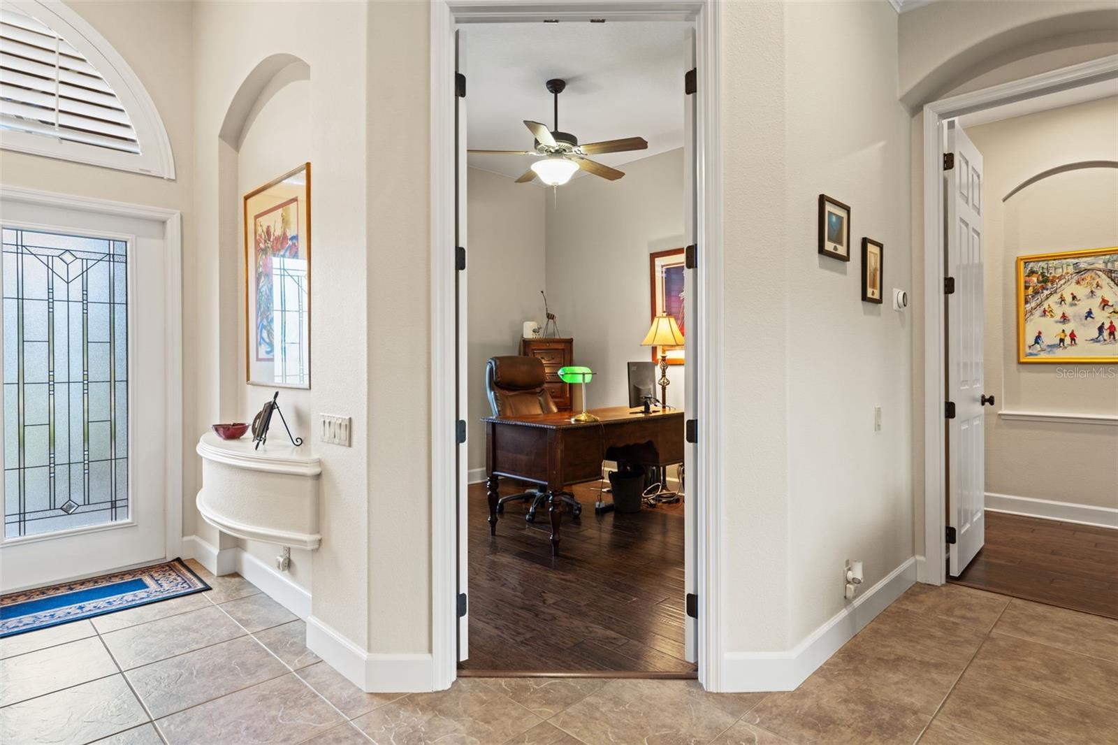 French doors open to the office, creating a flexible space just off the main living area with easy access to the foyer.