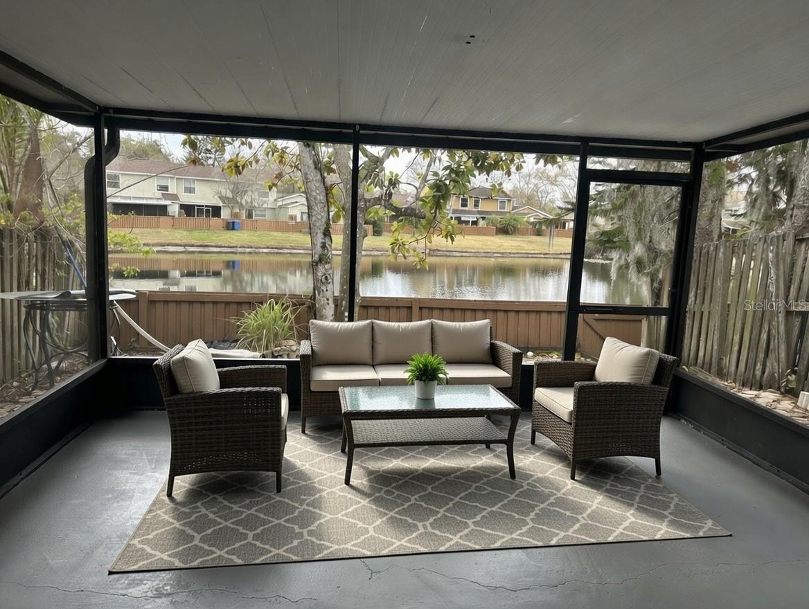 Screened back porch overlooking water