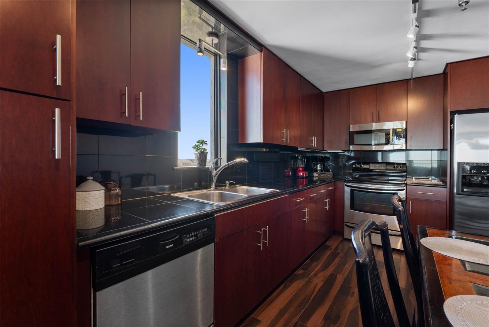 ... ALL NEW KITCHEN - OPENED UP - CORNER UNIT PROVIDING PLENTY OF NATURAL LIGHT. FANTASTIC BEACH LOCATION.