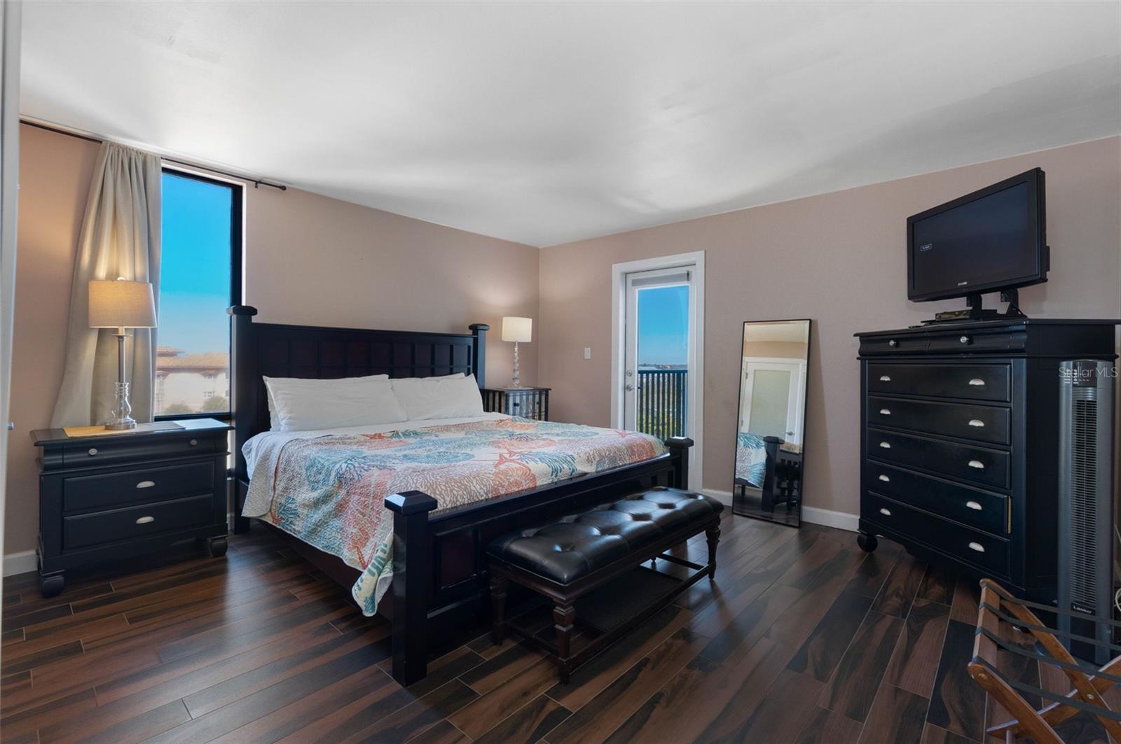 .. NICE SIZED BEDROOM WITH PLENTY OF NATURAL LIGHT .. CURTAINS AND SHADES ON WINDOWS AND REAR BALCONY OPENINGS FOR PRIVACY.