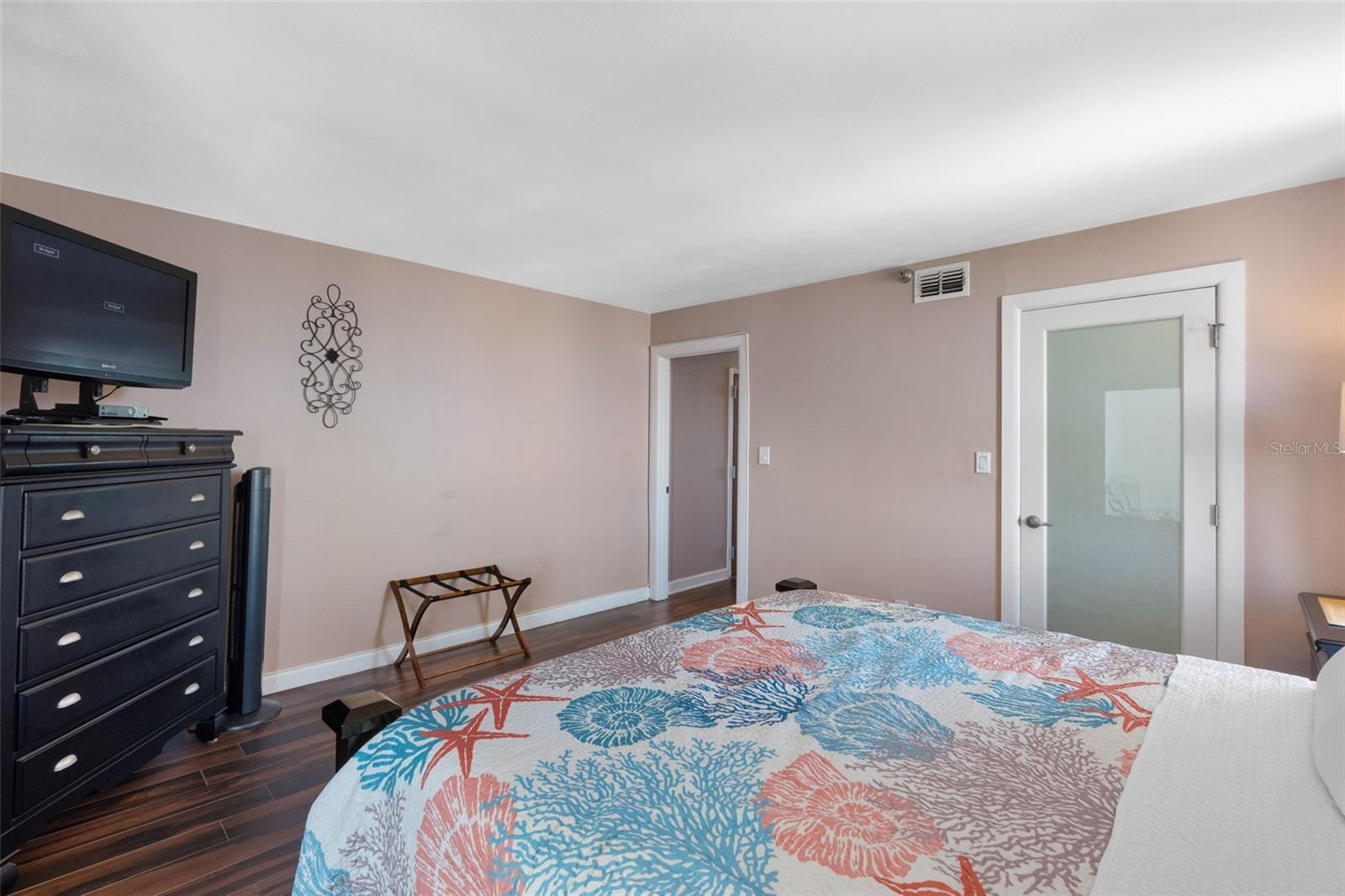 ..WALK - IN - CLOSET BEHIND SMOKED GLASS DOOR.