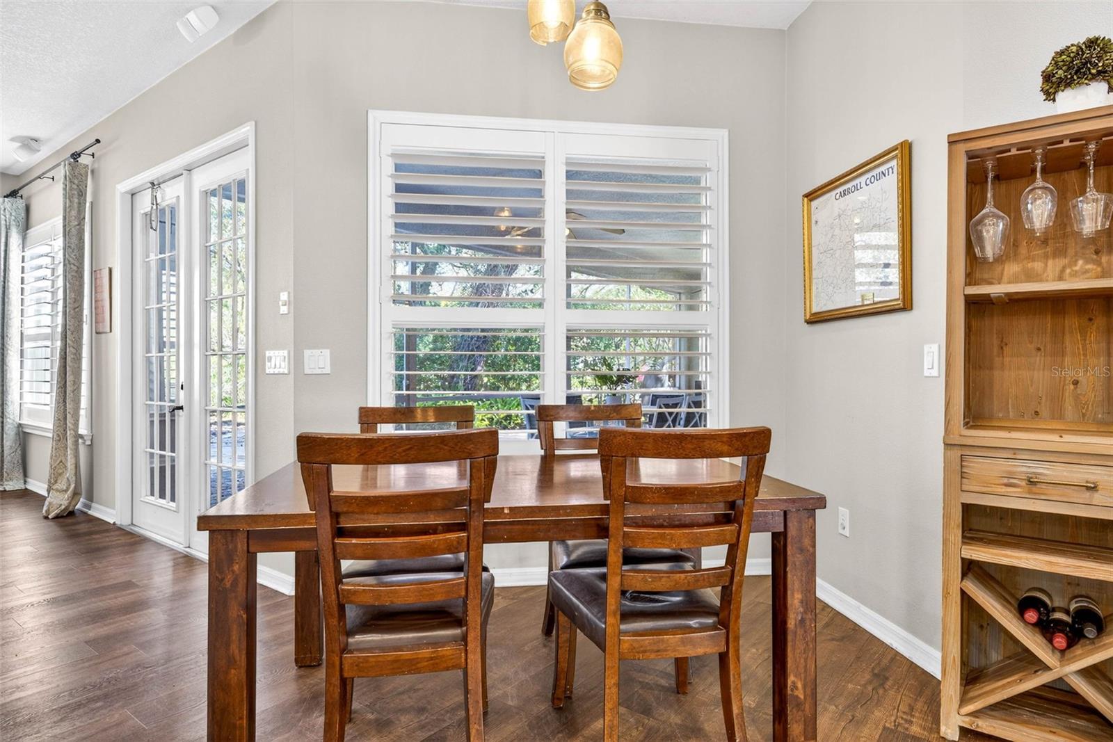 Breakfast nook compete with planation shutters adjustable to allow for as much natural lighting as you desire.