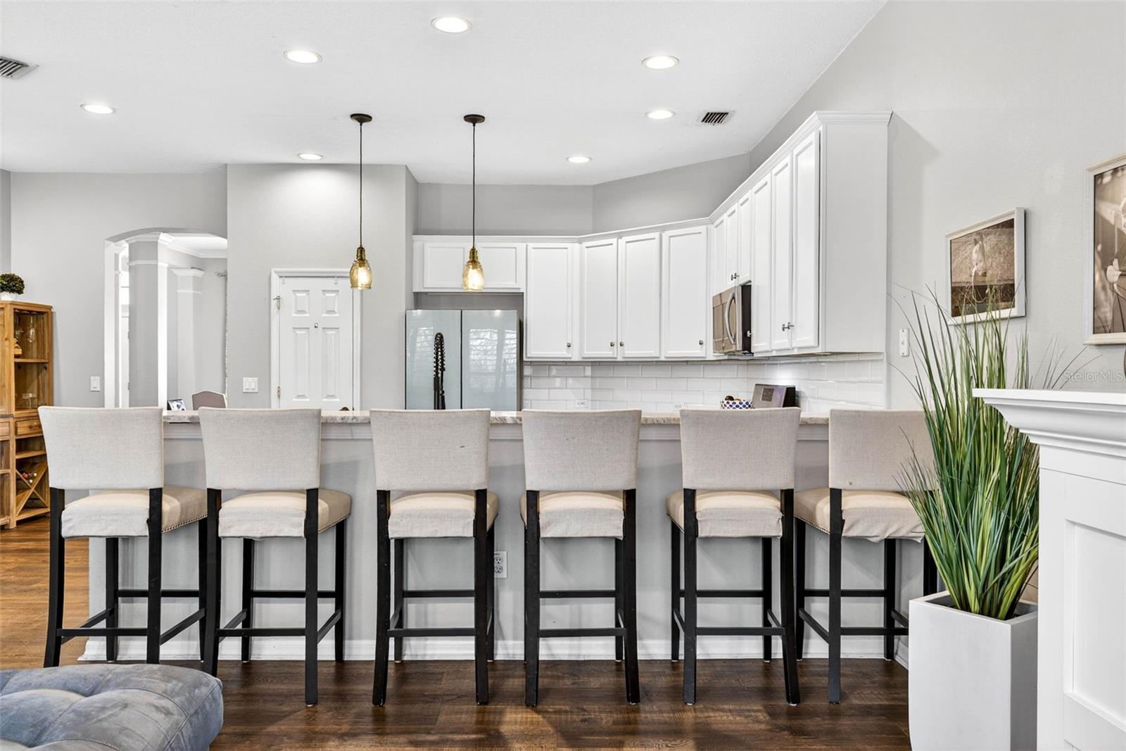 Extended bar with space for 6 bar stools. Perfect area for making memories!