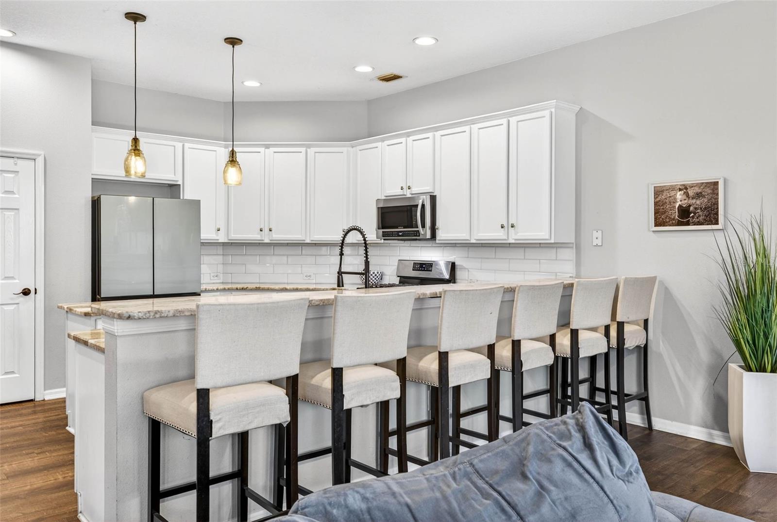 Kitchen overlooks family room.
