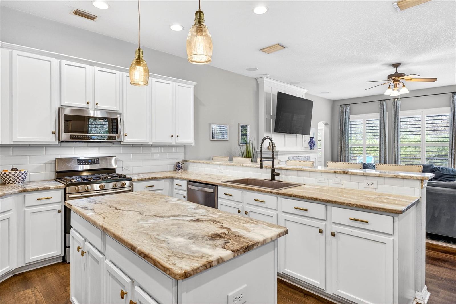 Large kitchen island and PLENTY of cabinet and counter space.