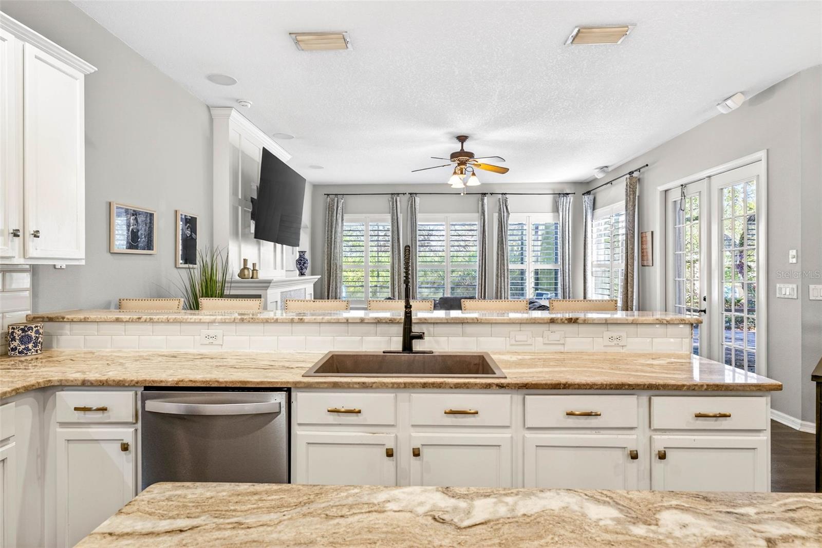 Large granite, single basin sink is a feature of this kitchen!