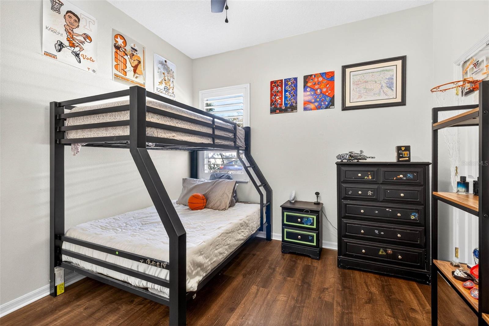 Secondary bedroom with walk in closet and ceiling fan