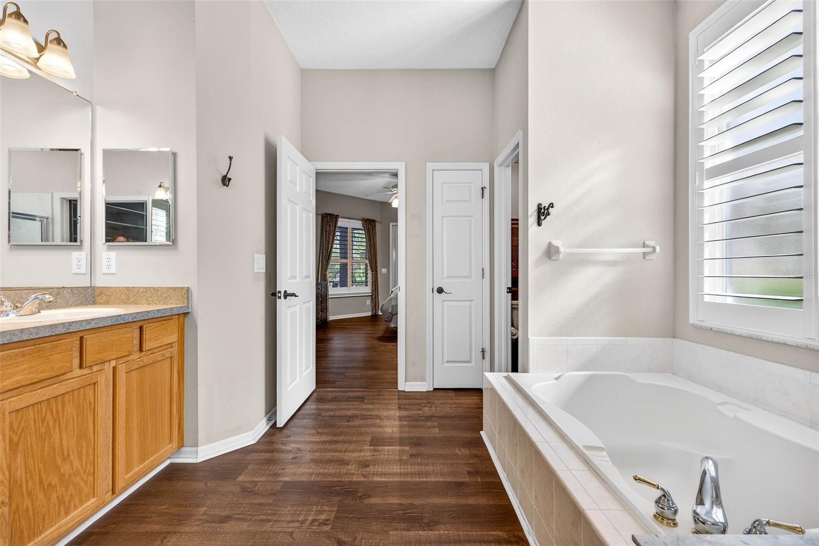 Primary bathroom features a private water closet and linen closet.
