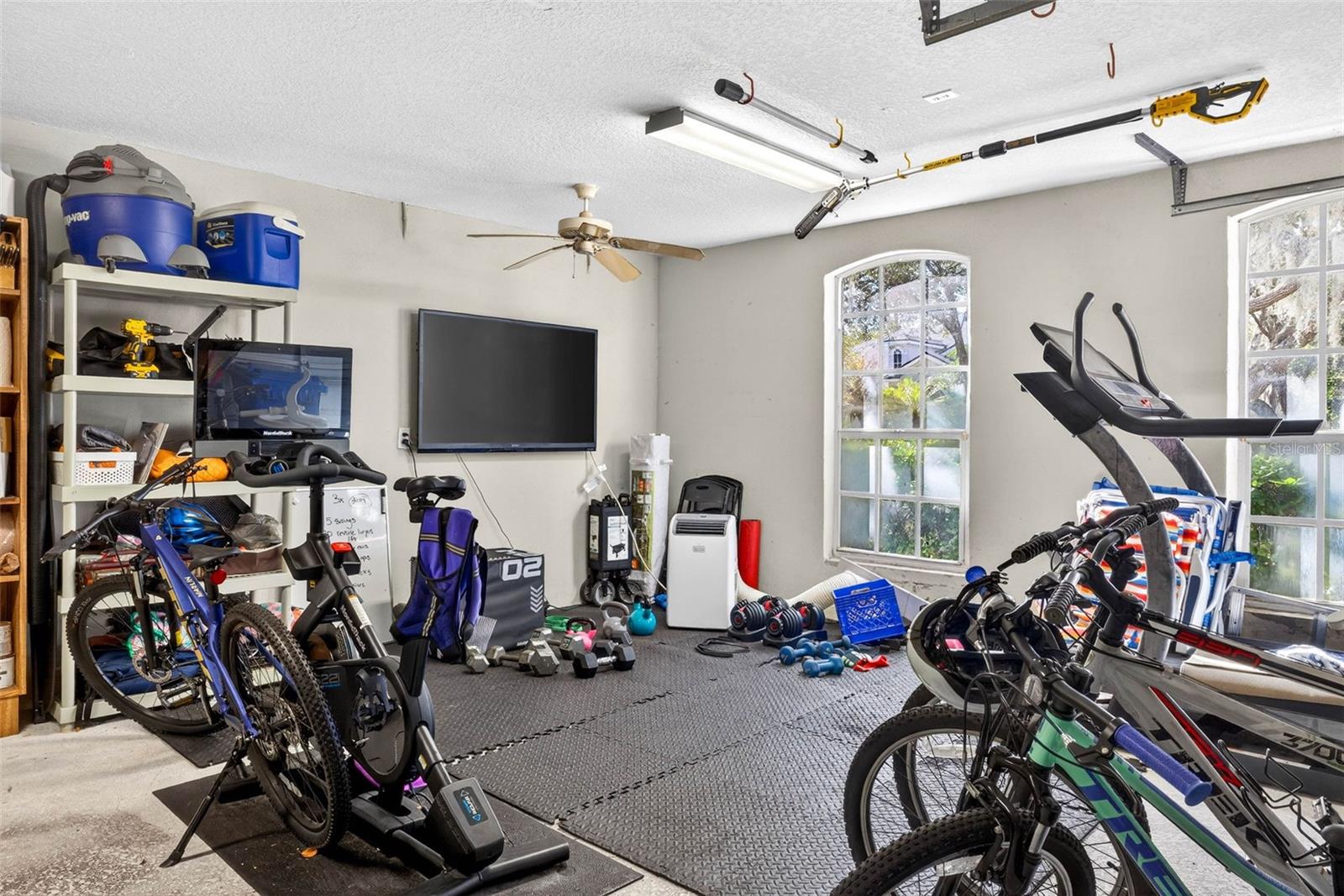 Seller is using 3rd bay of garage for a personal gym.
